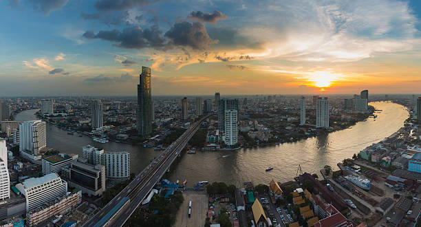 istock Panorama Bangkok city downtown river curved during sunset 621116068