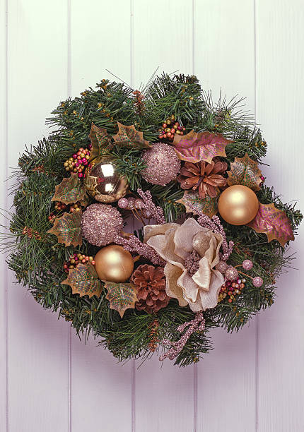 istock Christmas wreath on a rustic wooden front door. 621116112