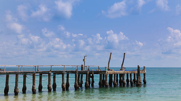 istock Pier over the sea with blue sky background 621117066