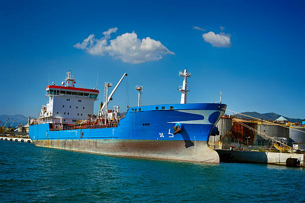 Container ship docked in English Bay waiting to enter the Vancouver Burrard Inlet harbor, British Columbia