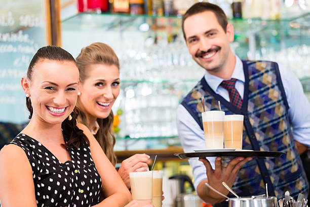istock Two women friends in cafe drinking cappuccino 621118086