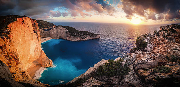 istock Sunset in Greece at Navagio Bay Zakynthos. Panoramic artistic vi 621118466