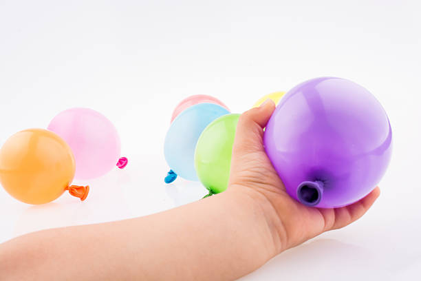 istock Hand holding a Colorful small balloon in hand 621119558