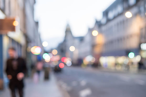 istock Blurred image of People walking on the street 621121382