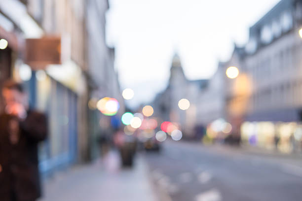 istock Blurred image of People walking on the street 621121424