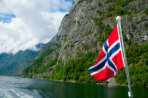 istock Norwegian flag waving in the fjords 621122508