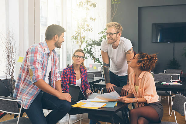 istock Young business people working at office on new project 621123658