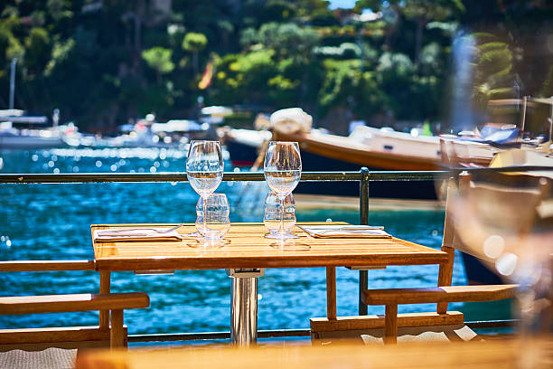 two wine glasses on table at harbor - dining nautical vessel recreational boat europe imagens e fotografias de stock