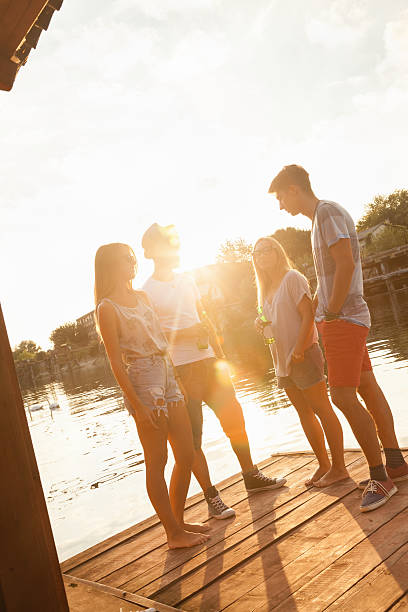 istock Friends Having Fun Near Lake 621126340