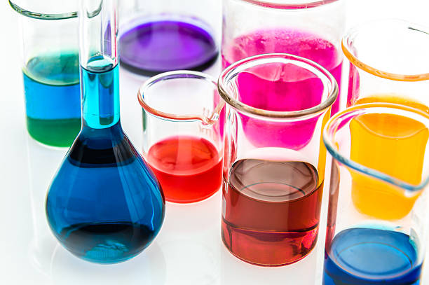 istock beakers with different types of indicators in acids and basis 621126632