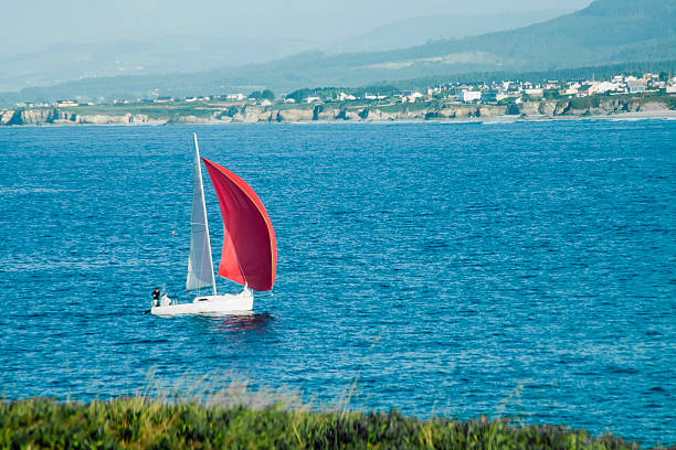 Sailing boat, coastline of Lugo province, Galicia, Spain.