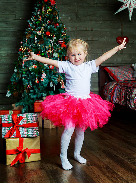 istock girl with presents 621129068