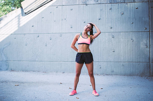 istock Fit woman runner stretching outdoors 621129620
