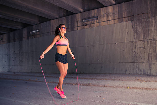 istock Fit woman runner warming up outdoors 621129784