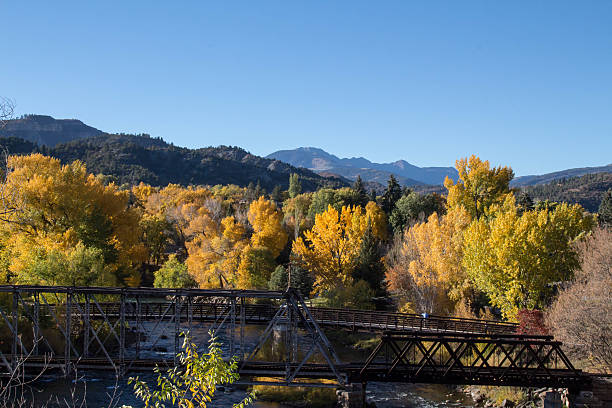 istock Bridges crossing the Animas river with autumn trees 621131776