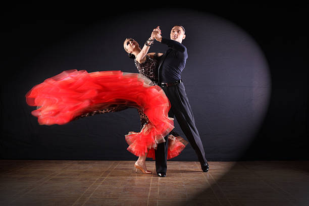 istock dancers in ballroom isolated on black background 621132050