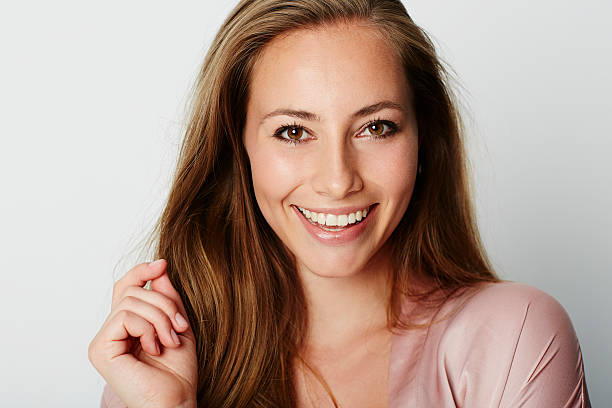 istock Brown eyed beauty smiling at camera 621133082