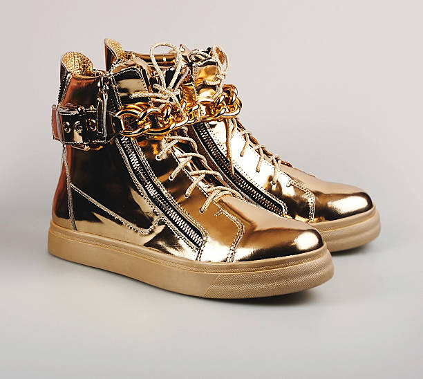 istock Stylish gold female boots 621134078
