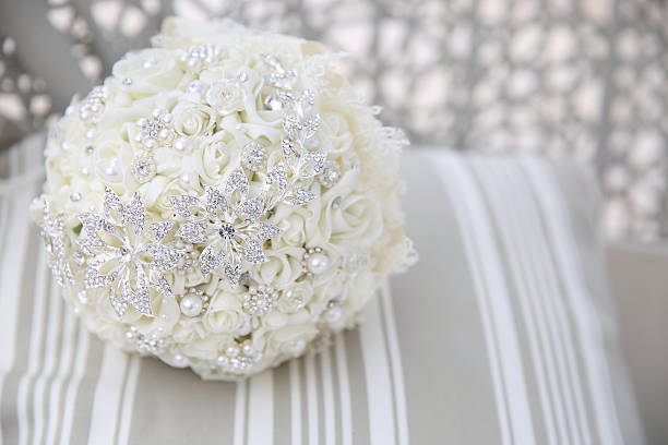 Wedding bouquet with red roses in the brideaas hands