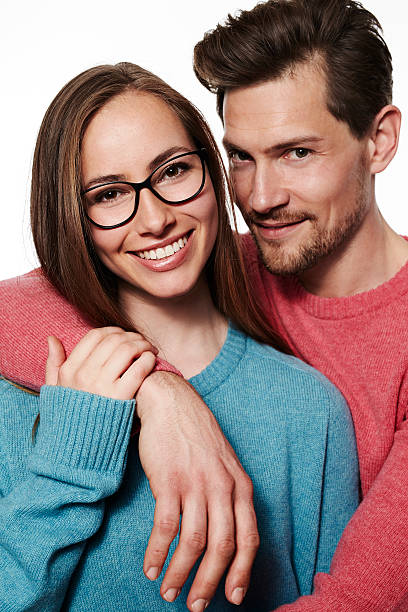 istock Beautiful smiling couple in studio, close up 621135492