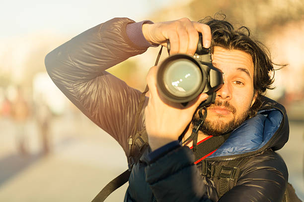 istock Photographer portrait with bokeh background 621136032