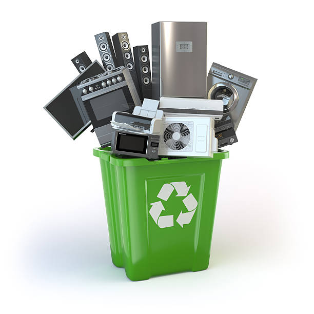 istock Old kitchen appliances in the rubbish bin isolated on white 621138848