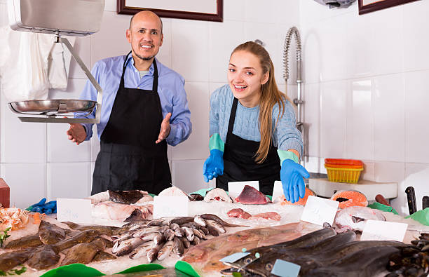 istock Two sellers in fish store 621139048