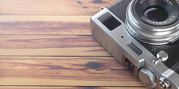 istock Retro vintage camera on wood table background. Space for text. 621139216