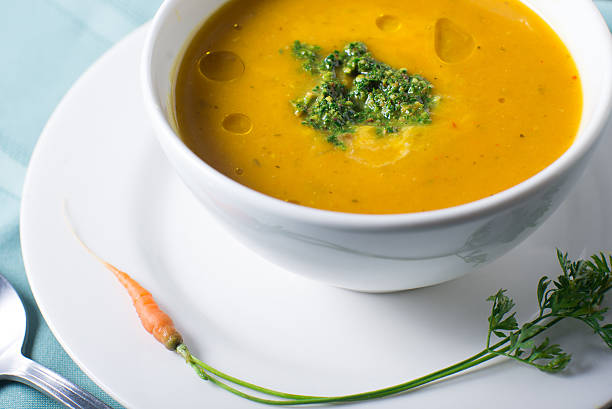 istock Fall pumpkin soup served in a bowl with pesto garnish 621139332