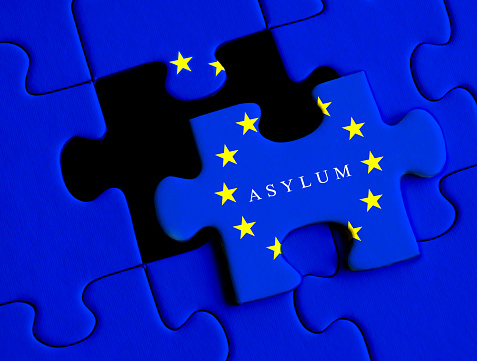 European Refugee crisis. Asylum puzzle concept with European Union flag.