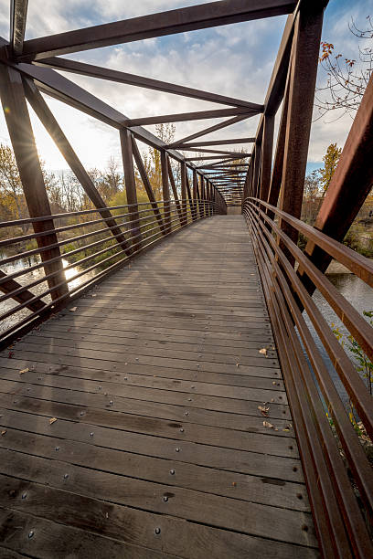 istock Morning sun rise on a Boise River foot bridge 621140530