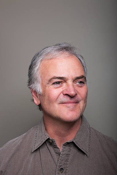 istock Portrait of smiling mature man. 621141508