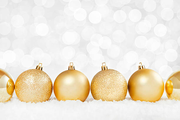 istock Gold Christmas Baubles on Snow Background 621142216
