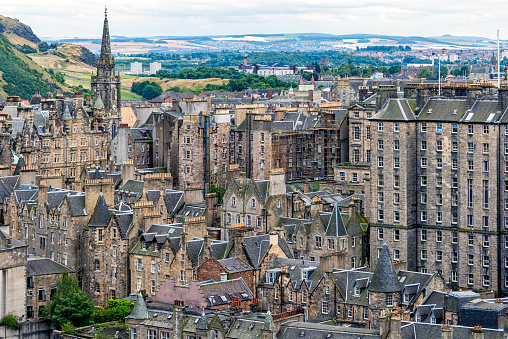 A view of Princes Street Gardens and Princes Street from high atop Edinburgh Castle in Edinburgh Scotland.  Princes Street is one of the main shopping streets in Edinburgh.