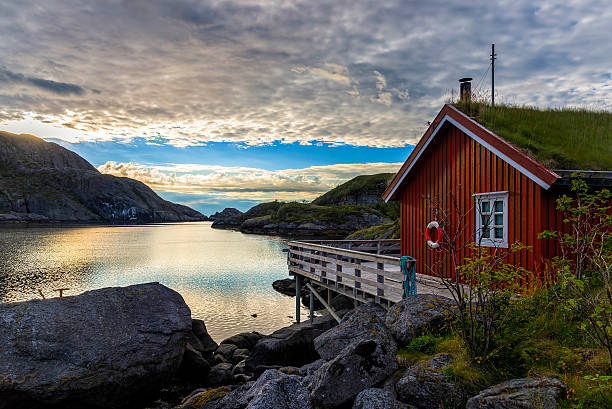 sunrise in nusfjord village, norway - fishing hut imagens e fotografias de stock