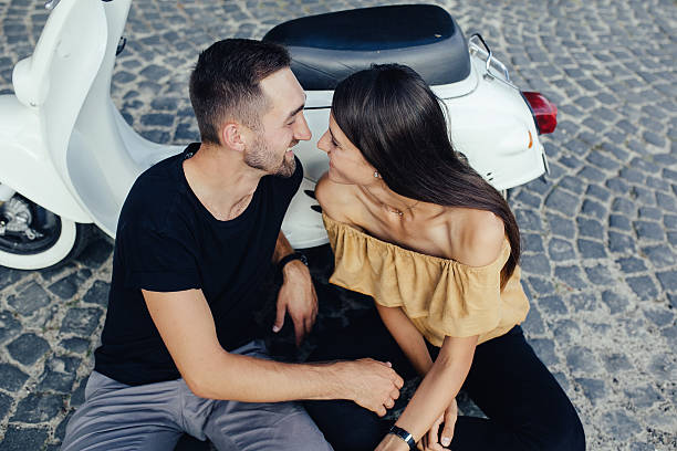 istock Cute couple with scooter 621145082