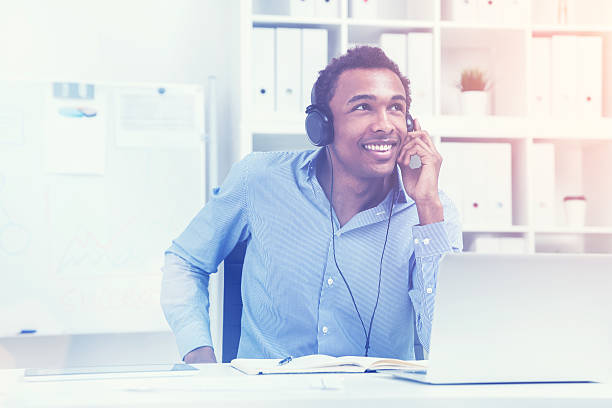 istock Smiling man listening to music, toned 621228136