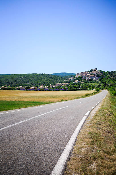 road to a small village among lavender fields - Provence, France