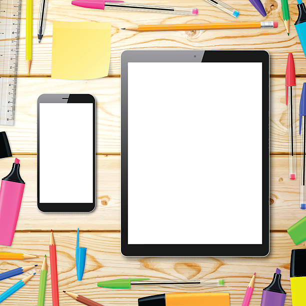 istock Smartphone and Tablet Pc on wooden desk with office supplies 621234626