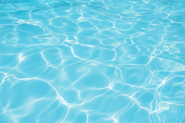 istock Beautiful blue water surface in swimming pool 621239302