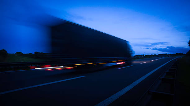 istock night on the road: blurred cars on a highway 621239558