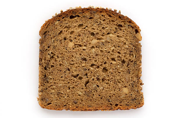 istock Slice of Brown Bread isolated on white background 621240010