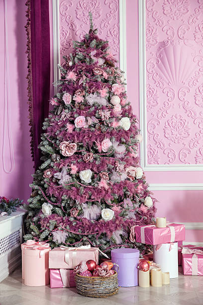 istock New Year tree decorated in pink toys 621242382