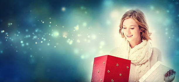 istock Happy young woman with Christmas present box 621243220