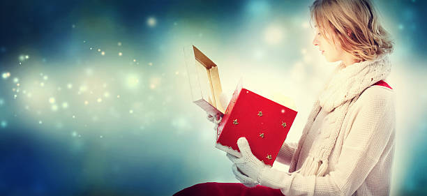 istock Young woman with Christmas present box 621243276