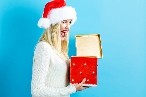 istock Happy young woman with Christmas present box 621243278