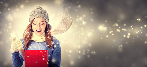 Happy young woman with Christmas present box