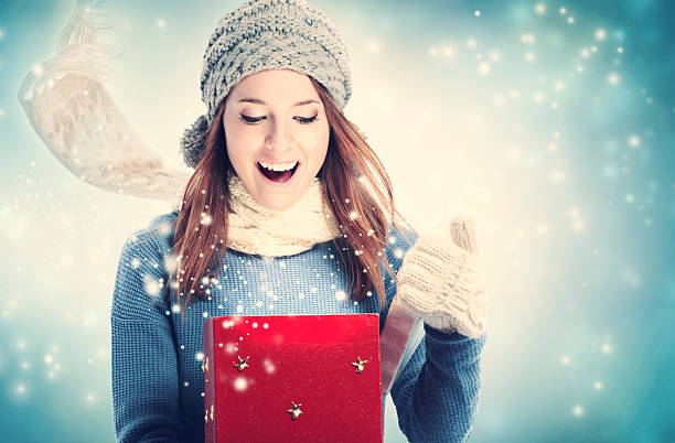 istock Happy young woman with Christmas present box 621243330