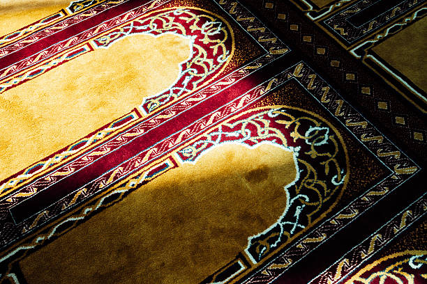 Decorated carpet of a mosque with sunlight