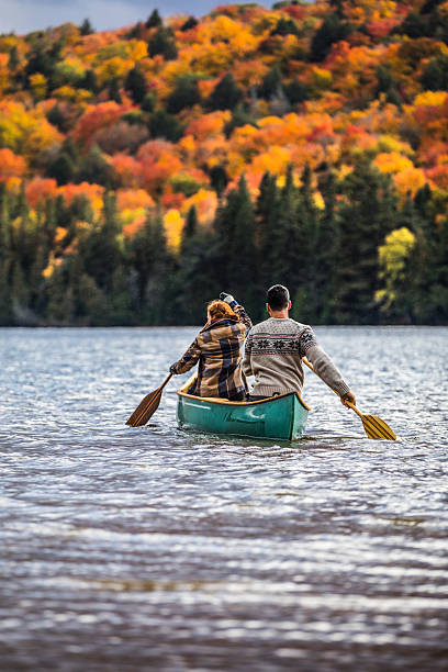 istock Couple enjoying a ride on a typical canoe in Canada 621243596